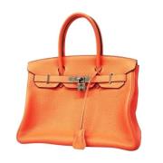 Pre-owned Leather handbags Hermès Vintage , Orange , Dames