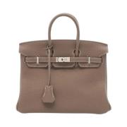 Pre-owned Leather handbags Hermès Vintage , Beige , Dames