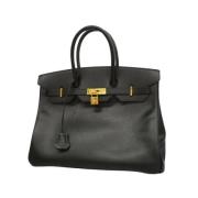 Pre-owned Leather handbags Hermès Vintage , Black , Dames