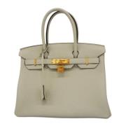 Pre-owned Leather handbags Hermès Vintage , Beige , Dames