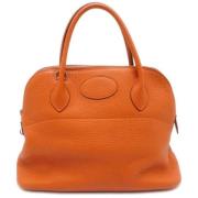 Pre-owned Leather handbags Hermès Vintage , Orange , Dames