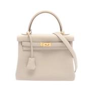 Pre-owned Leather handbags Hermès Vintage , Beige , Dames