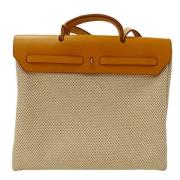 Pre-owned Canvas handbags Hermès Vintage , Beige , Dames