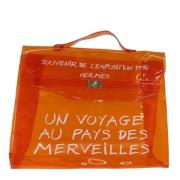 Pre-owned Vinyl handbags Hermès Vintage , Orange , Dames