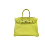 Pre-owned Leather handbags Hermès Vintage , Yellow , Dames