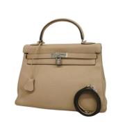 Pre-owned Leather handbags Hermès Vintage , Beige , Dames