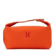 Pre-owned Canvas pouches Hermès Vintage , Orange , Dames