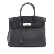 Pre-owned Leather handbags Hermès Vintage , Black , Dames