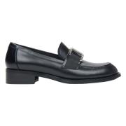 Zwarte leren pennyloafers voor dames met een decoratieve gesp Estro , ...