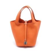 Pre-owned Leather handbags Hermès Vintage , Orange , Dames