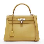 Pre-owned Leather handbags Hermès Vintage , Yellow , Dames