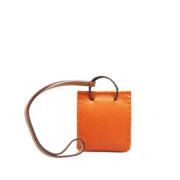 Pre-owned Leather key-holders Hermès Vintage , Orange , Dames