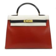 Pre-owned Leather handbags Hermès Vintage , Red , Dames