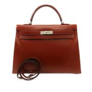 Pre-owned Leather handbags Hermès Vintage , Red , Dames