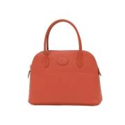 Pre-owned Leather handbags Hermès Vintage , Orange , Dames