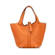 Pre-owned Leather handbags Hermès Vintage , Orange , Dames