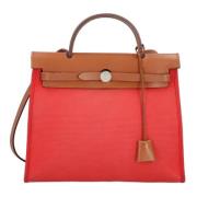 Pre-owned Canvas handbags Hermès Vintage , Red , Dames