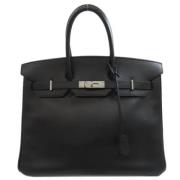 Pre-owned Leather handbags Hermès Vintage , Black , Dames