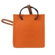 Pre-owned Leather home-office Hermès Vintage , Orange , Dames