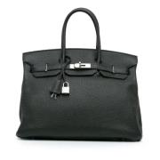 Pre-owned Leather handbags Hermès Vintage , Black , Dames