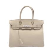 Pre-owned Leather handbags Hermès Vintage , Beige , Dames