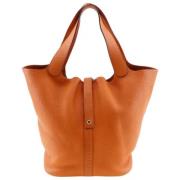 Pre-owned Leather handbags Hermès Vintage , Orange , Dames