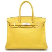 Pre-owned Leather handbags Hermès Vintage , Yellow , Dames