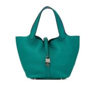 Pre-owned Leather handbags Hermès Vintage , Green , Dames