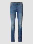 Stone-washed low rise slim fit jeans