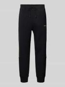 Tapered fit sweatpants met labeldetail, model 'Hadikonos'