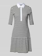Knielange polojurk met knoopsluiting