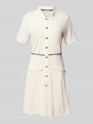 Knielange polojurk met knoopsluiting
