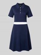 Knielange polojurk met korte knoopsluiting