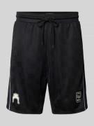 Relaxed fit korte broek met motief- en labelprint, model 'Football'