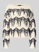 Gebreide pullover met applicaties