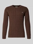 Gebreide pullover met kabelpatroon en labelstitching