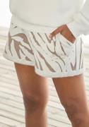 NU 20% KORTING: Lascana Relaxshorts zijzakken en logostiksel, loungewe...